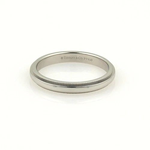 TIFFANY & CO. PLATINUM WEDDING BAND DOUBLE MILGRAIN RING SIZE 7.75: TIFFANY & CO. PLATINUM WEDDING BAND DOUBLE MILGRAIN RING SIZE 7.75 The Tiffany & Co. Platinum Wedding Band Double Milgrain Ring is a luxurious and elegant piece of fine jewelry. Made with 950 platinum
