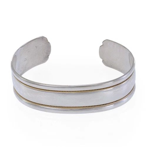 TIFFANY & CO. CUFF BRACELET STERLING SILVER 18K YELLOW GOLD 17MM WIDE: TIFFANY & CO. CUFF BRACELET STERLING SILVER 18K YELLOW GOLD 17MM WIDE Tiffany & Co. Sterling Silver 18k Yellow Gold 17mm Wide Cuff Bracelet Description This elegant authentic cuff bracelet is from Tif