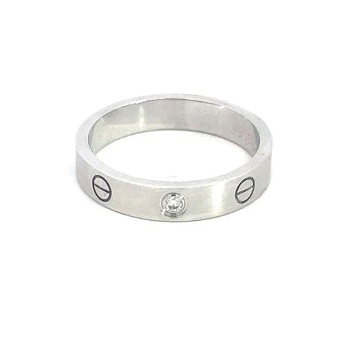 CARTIER LOVE 1 DIAMOND GOLD RING 18K WHITE MINI STYLE RING W/PAPER SIZE 55: This gold ring is by Cartier from the Love Collection, it is in the mini style with one diamond and screw motifs set in 18k white gold. This beautiful ring symbolizes love with its simple yet elegant 