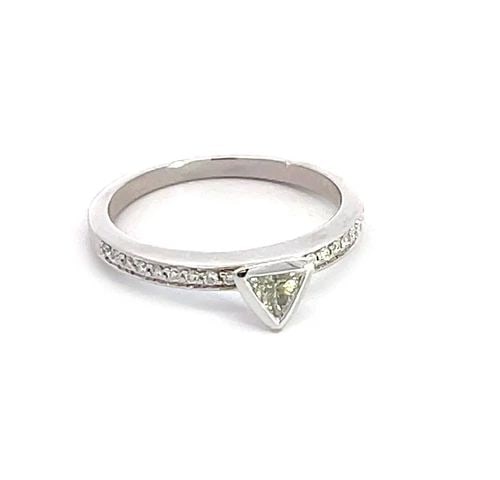 MOVADO TRILLION CUT DIAMOND 18K WHITE GOLD ENGAGEMENT RING: MOVADO TRILLION CUT DIAMOND 18K WHITE GOLD ENGAGEMENT RING Authentic and elegant by Movado, this ring is crafted from 18k white gold with a trillion cut diamond in bezel mount at the top of the shank 