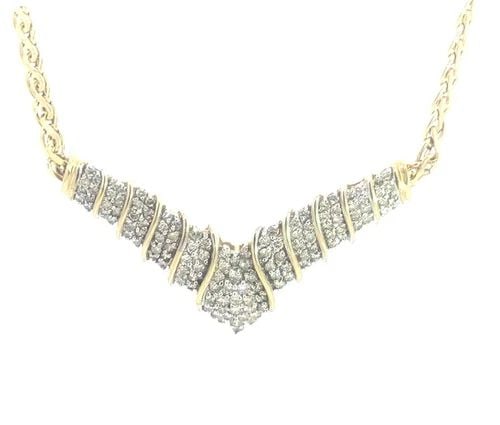 70533 DIAMOND GOLD NECKLACE 10K TWO TONE WING SHAPE S LINK CHAIN: 70533 DIAMOND GOLD NECKLACE 10K TWO TONE WING SHAPE S LINK CHAIN This lovely necklace is crafted from 10k yellow gold with white gold accent, it features a wide wing shape pendant attached to a flat s