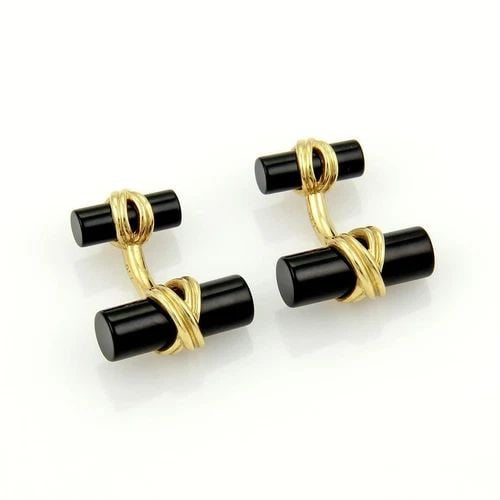 TIFFANY & CO. ONYX CUFFLINKS COLUMN BAR 18K YELLOW GOLD X DESIGN: TIFFANY & CO. ONYX CUFFLINKS COLUMN BAR 18K YELLOW GOLD X DESIGN The Tiffany & Co. Onyx Cufflinks are a luxurious accessory for men, crafted from 18k yellow gold with a sleek X design. The cufflinks f