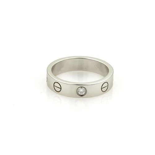 CARTIER RING MINI LOVE 1 DIAMOND 18K WHITE GOLD 4MM BAND SIZE 47-US 4: CARTIER RING MINI LOVE 1 DIAMOND 18K WHITE GOLD 4MM BAND SIZE 47-US 4 The Cartier Ring Mini Love 1 Diamond is a stunning piece of fine jewelry crafted from 18k white gold with a 4mm band. This elegant