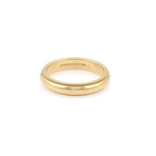 TIFFANY & CO. WEDDING BAND 18K YELLOW GOLD DOUBLE MILGRAIN DESIGN RING SIZE 7.5: TIFFANY & CO. WEDDING BAND 18K YELLOW GOLD DOUBLE MILGRAIN DESIGN RING SIZE 7.5 The Tiffany & Co. Wedding Band is a stunning 18k yellow gold ring with a double milgrain design, perfect for a special o