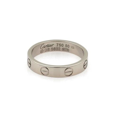 CARTIER RING MINI LOVE 18K WHITE GOLD 3.5MM BAND SIZE 50-US 5.25: The Cartier Ring Mini Love is a stunning piece of fine jewelry made of 18k white gold with a band style design. This ring, with a size 50-US 5.25, is customized and signed by the French brand Cartier.