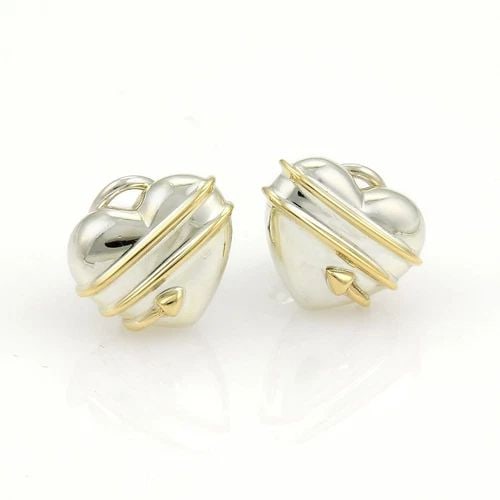 TIFFANY & CO. CUPID'S EARRINGS ARROW HEARTS STERLING SILVER 18K GOLD CLIP ON: TIFFANY & CO. CUPID'S EARRINGS ARROW HEARTS STERLING SILVER 18K GOLD CLIP ON Tiffany & Co. Cupid's Arrow Sterling 18k YGold Hearts Clip On Earrings Description This authentic pair of earrings are by T