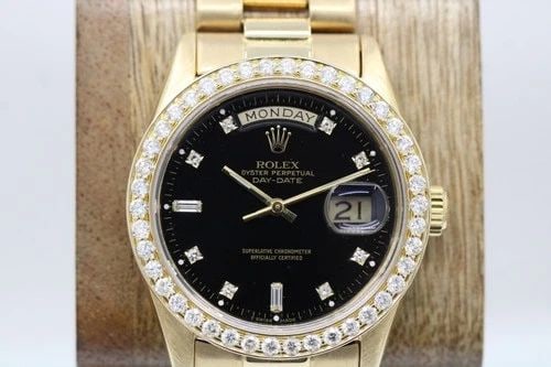ROLEX PRESIDENT DAY-DATE 18K GOLD DIAMOND BEZEL 36MM BLACK DIAL WATCH 18038: ROLEX PRESIDENT DAY-DATE DIAMOND BEZEL & MARKERS 36MM BLACK DIAL WATCH Description Rolex President Day-Date Diamond Bezel & Markers 36mm Black Dial Watch 18038 The watch has been used previously. The 