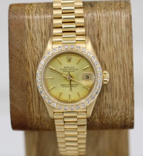 ROLEX PRESIDENT DATEJUST 18K YELLOW GOLD 26MM DIAL DIAMOND BEZEL WATCH 69178: ROLEX PRESIDENT DATEJUST 18K YELLOW GOLD 26MM DIAL DIAMOND BEZEL WATCH 69178 Description Rolex President DateJust 18K Yellow Gold 26mm Dial Diamond Bezel Watch The watch has been used previously. The 