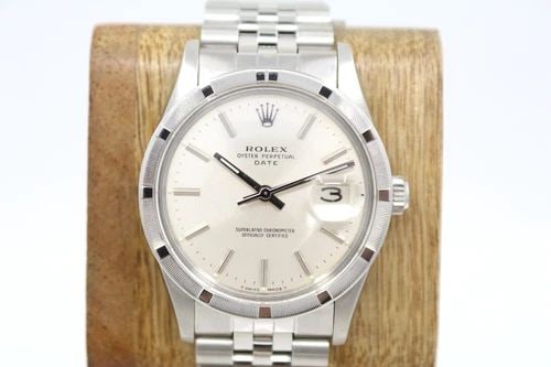 1981 ROLEX PERPETUAL DATE 34MM SILVER DIAL ENGINE TURNED BEZEL WATCH 15010: 1981 ROLEX PERPETUAL DATE 34MM SILVER DIAL ENGINE TURNED BEZEL WATCH 15010 Description 1981 Rolex Oyster Perpetual Date 34mm Silver Dial Engine Tuned Bezel Watch 15010 The watch has been used previous