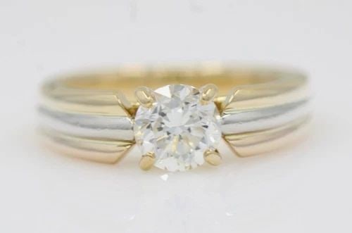 18K YELLOW GOLD / 900 PLATINUM 1.01 CT VS2 NATURAL DIAMOND RING SIZE 6 - 6.4 G: 18K YELLOW GOLD / 900 PLATINUM 1.01 CT VS2 NATURAL DIAMOND RING SIZE 6 - 6.4 G Description 18K Yellow Gold / 900 Platinum 1.01 CT VS2 Natural Diamond Ring The ring is in good condition. May show signs