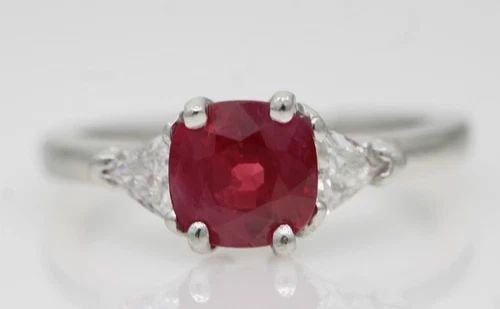 VINTAGE PLATINUM 1.75 TCW CUSHION CUT RUBY & DIAMOND RING SIZE 6.5: VINTAGE PLATINUM 1.75CT CUSHION CUT RUBY & 0.35CT DIAMOND RING SIZE 6.5 Description Vintage Platinum 1.75ct Cushion Cut Ruby & 0.35ct Diamond Ring Ring is in good condition. May show signs of wear and