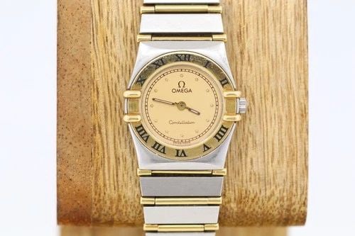 OMEGA CONSTELLATION TWO-TONE 18K YELLOW GOLD & STEEL 23MM CHAMPAGNE DIAL WATCH: OMEGA CONSTELLATION TWO-TONE 18K YELLOW GOLD & STEEL 23MM CHAMPAGNE DIAL WATCH Description Omega Constellation Two-Tone 18k Yellow Gold & Steel 23mm Champagne Dial Watch The watch has been used previo