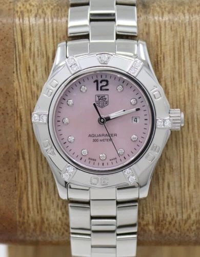 TAG HEUER AQUARACER 27MM PINK MOP DIAMOND DIAL & BEZEL QUARTZ WATCH WAF141H: TAG HEUER AQUARACER 27MM PINK MOP DIAMOND DIAL & BEZEL QUARTZ WATCH WAF141H Description TAG Heuer Aquaracer 27mm Pink MOP Diamond Dial & Bezel Quartz Watch WAF141H The watch has been used previously. 