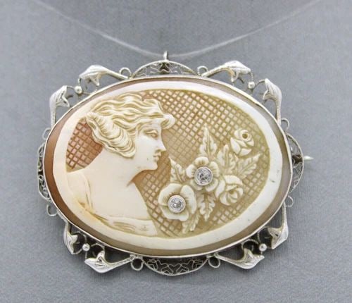 14K WHITE GOLD CARVED CAMEO DIAMOND PENDANT BROOCH 12.6 GRAMS: 14K WHITE GOLD CARVED CAMEO DIAMOND PENDANT BROOCH 12.6 GRAMS 14K WHITE GOLD CARVED CAMEO DIAMOND PENDANT BROOCH 12.6 GRAMS Description 14K White Gold Carved Cameo Diamond Pendant Brooch The pendant /