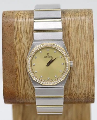 CONCORD MARINER 18K TWO-TONE DIAMOND QUARTZ 25MM GOLD DIAL WATCH 15-62-148: CONCORD MARINER 18K TWO-TONE DIAMOND QUARTZ 25MM GOLD DIAL WATCH 15-62-148 Description Concord Mariner 18K Two-Tone Diamond Quartz 25mm Gold Dial Watch 15-62-148 The watch has been used previously. Th