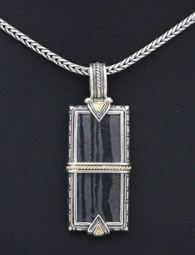 KONSTANTINO STERLING SILVER & 18K GOLD CARVED FERRITE PENDANT NECKLACE 26" W/BOX: KONSTANTINO STERLING SILVER & 18K GOLD CARVED FERRITE PENDANT NECKLACE 26" W/BOX Description Konstantino Sterling Silver & 18K Yellow Gold Carved Ferrite Pendant Necklace Pendant/necklace is in good c