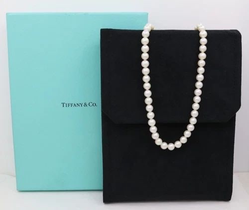 TIFFANY & CO. STERLING SILVER 7MM PEARL NECKLACE 16": TIFFANY & CO. STERLING SILVER 7MM PEARL NECKLACE 16" Description Tiffany & Co. Sterling Silver 7mm Pearl Necklace Necklace is in good condition. May show signs of wear and/or tear. Approximate Measure