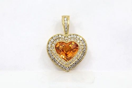 MW 14K YELLOW GOLD CITRINE & DIAMOND HALO HEART PENDANT: MW 14K YELLOW GOLD CITRINE & DIAMOND HALO HEART PENDANT Description MW 14K Yellow Gold Citrine & Diamond Halo Pendant Pendant is in good condition. May show signs of wear and/or tear. Approximate Meas