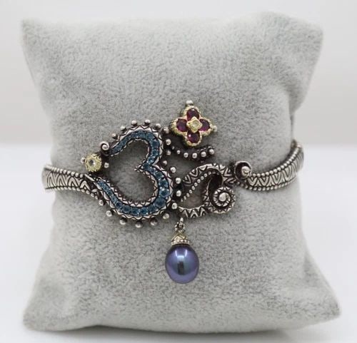 BARBARA BIXBY STERLING & 18K GOLD TOPAZ, PEARL & MULTI GEMSTONE CUFF BRACELET: BARBARA BIXBY STERLING & 18K GOLD TOPAZ, PEARL & MULTI GEMSTONE CUFF BRACELET Description Barbara Bixby Sterling Silver & 18K Gold Topaz, Pearl, & Multi Gemstone Cuff Bracelet Bracelet is in good cond