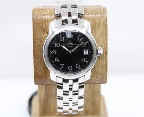 BAUME & MERCIER CAPELAND 37MM BLACK DATE DIAL STAINLESS WATCH MV045214: BAUME & MERCIER CAPELAND 37MM BLACK DATE DIAL STAINLESS WATCH MV045214 Description Baume & Mercier Capeland 37mm Black Date Dial Stainless Watch MV045214 The watch has been used previously. The watch 