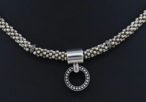LAGOS CAVIAR ENSO STERLING SILVER BEADED CIRCLE PENDANT NECKLACE 18"- 49.8 GRAMS: LAGOS CAVIAR ENSO STERLING SILVER BEADED CIRCLE PENDANT NECKLACE 18"- 49.8 GRAMS Description Lagos Caviar Enso Sterling Silver Beaded Circle Pendant Necklace Necklace is in good condition. May show si
