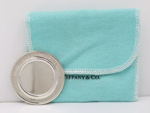 2003 TIFFANY & CO. STERLING SILVER 925 HEADS OR TAILS FLIP COIN: 2003 TIFFANY & CO. STERLING SILVER 925 HEADS OR TAILS FLIP COIN Description 2003 Tiffany & Co. Sterling Silver 925 Heads or Tails Flip Coin Coin is in average circulated condition. May show signs of w