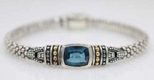 LAGOS STERLING SILVER & 18K GOLD 6MM BLUE TOPAZ CAVIAR ROPE BRACELET MEDIUM: LAGOS STERLING SILVER & 18K GOLD 6MM BLUE TOPAZ CAVIAR ROPE BRACELET MEDIUM Description Lagos Sterling Silver & 18K Gold 6mm Blue Topaz Caviar Rope Bracelet Bracelet is in good condition. May show sig