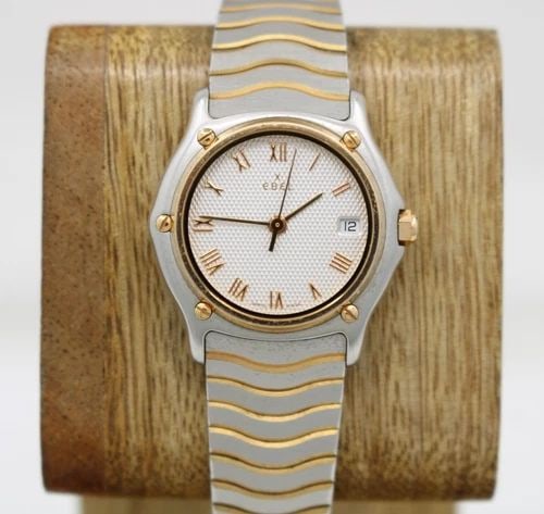 EBEL SPORT CLASSIQUE TWO TONE 18K GOLD 27MM SILVER DIAL DATE WATCH 1087123: EBEL SPORT CLASSIQUE TWO TONE 18K GOLD 27MM SILVER DIAL DATE WATCH 1087123 Description EBEL Sport Classique Two Tone 18K Gold 27mm Silver Dial Date Watch 1087123 The watch has been used previously. Th