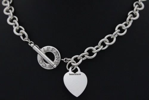 TIFFANY & CO. STERLING BLANK (ENGRAVED T.L.W) HEART TAG 16" TOGGLE NECKLACE: TIFFANY & CO. STERLING BLANK (ENGRAVED T.L.W) HEART TAG 16" TOGGLE NECKLACE TIFFANY & CO. STERLING BLANK (ENGRAVED T.L.W) HEART TAG 16" TOGGLE NECKLACE Description Tiffany & Co. Sterling Silver Blank 