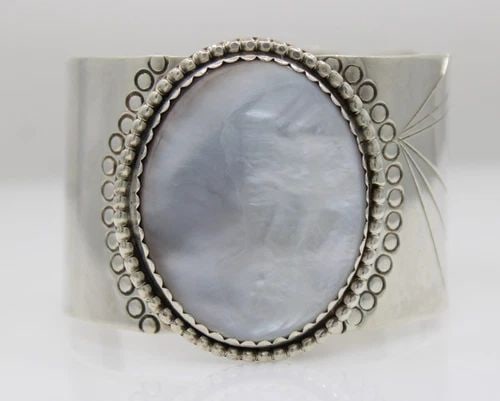H STERLING SILVER NAVAJO MOTHER OF PEARL CUFF BRACELET 6 1/4" - 85.1 GRAMS: H STERLING SILVER NAVAJO MOTHER OF PEARL CUFF BRACELET 6 1/4" - 85.1 GRAMS Description H Signed Sterling Silver Navajo Mother of Pearl Cuff Bracelet Bracelet is in good condition. May show signs of we