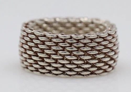 TIFFANY & CO. STERLING SILVER 10MM SOMERSET MESH BAND RING SIZE 5: TIFFANY & CO. STERLING SILVER 10MM SOMERSET MESH BAND RING SIZE 5 Description Tiffany & Co. Sterling Silver Somerset Mesh Band Ring Ring is in good condition. May show signs of wear and/or tear. Appro