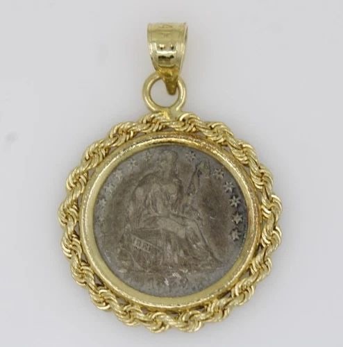 1859 SEATED LIBERTY HALF DIME SILVER COIN IN 14K YELLOW GOLD BEZEL PENDANT: 1859 SEATED LIBERTY HALF DIME SILVER COIN IN 14K YELLOW GOLD BEZEL PENDANT Description 1859 Seated Liberty Half Dime Silver Coin in 14K Yellow Gold Braided Fame Pendant The coin & pendant are in good 