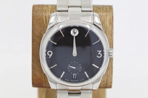 MOVADO LX STAINLESS 42MM BLACK DATE DIAL QUARTZ WATCH W/ BOX 38.1.14.1206: MOVADO LX STAINLESS 42MM BLACK DATE DIAL QUARTZ WATCH W/ BOX 38.1.14.1206 Description Movado LX Stainless 42mm Black Date Dial Quartz Watch W/ Box 38.1.14.1206 The watch has been used previously. The 