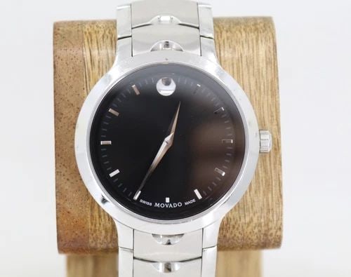 MOVADO LUNO STELLER SS W/ AZIURE 40MM BLACK DIAL QUARTZ MEN’S WATCH 56.2.14.1362: MOVADO LUNO STELLER SS W/ AZIURE 40MM BLACK DIAL QUARTZ MEN’S WATCH 56.2.14.1362 Description Movado Luno Steller SS W/ Aziure 40mm Black Dial Quartz Men’s Watch The watch has been used previously.