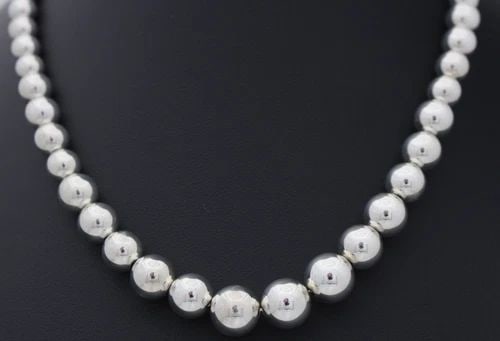 TIFFANY & CO. GRADUATED STERLING SILVER BALL BEADED NECKLACE 16.25": TIFFANY & CO. GRADUATED STERLING SILVER BALL BEADED NECKLACE 16.25" Description Tiffany & Co. Sterling Silver Ball Beaded Necklace 16" Necklace is in good condition. May show signs of wear and/or tear