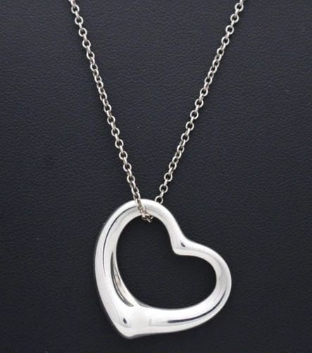 TIFFANY & CO ELSA PERETTI STERLING SILVER OPEN HEART PENDANT 19": TIFFANY & CO ELSA PERETTI STERLING SILVER OPEN HEART PENDANT 19" Description Tiffany & Co Elsa Peretti Sterling Silver Open Heart Pendant Pendant/necklace is in good condition. May show signs of wear 