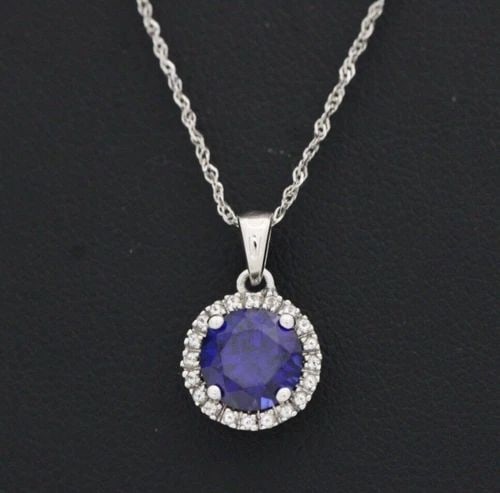 10K WHITE GOLD BLUE SAPPHIRE & HALO DIAMONDS 15MM PENDANT W/ 18" NECKLACE: 10K WHITE GOLD BLUE SAPPHIRE & HALO DIAMONDS 15MM PENDANT W/ 18" NECKLACE 10K WHITE GOLD BLUE SAPPHIRE & HALO DIAMONDS 15MM PENDANT W/ 18" NECKLACE Description 10K White Gold Blue Sapphire & Halo Diam