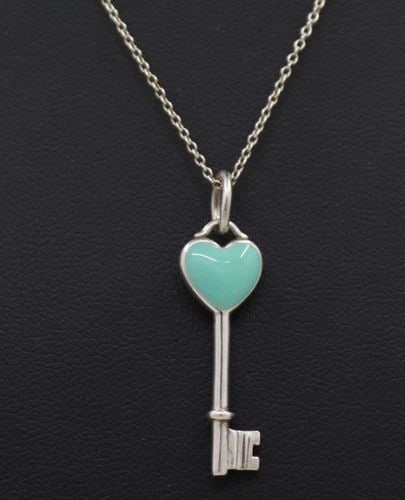 TIFFANY & CO. STERLING SILVER BLUE ENAMEL HEART TIFFANY KEY PENDANT NECKLACE 16": TIFFANY & CO. STERLING SILVER BLUE ENAMEL HEART TIFFANY KEY PENDANT NECKLACE 16" Description Tiffany & Co. Sterling Silver Blue Enamel Heart Tiffany Key Pendant Necklace Necklace is in good condition.