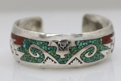 NAVAJO DELVIN NELSON STERLING SILVER TURQUOISE & CORAL INLAY CUFF BRACELET 6": NAVAJO DELVIN NELSON STERLING SILVER TURQUOISE & CORAL INLAY CUFF BRACELET 6" Description Navajo Delvin Nelson Sterling Silver Turquoise & Coral Inlay Cuff Bracelet Bracelet is in good condition. May 