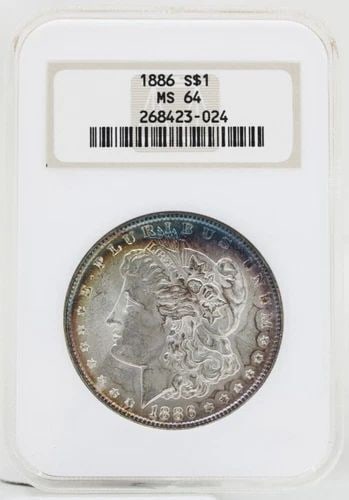 1886 MORGAN SILVER DOLLAR NGC MS-64 OLD FAT HOLDER RAINBOW TONING: 1886 MORGAN SILVER DOLLAR NGC MS-64 OLD FAT HOLDER RAINBOW TONING 1886 MORGAN SILVER DOLLAR NGC MS-64 OLD FAT HOLDER RAINBOW TONING Description 1886 Morgan Silver Dollar NGC MS-64 Old Fat Holder Rainb