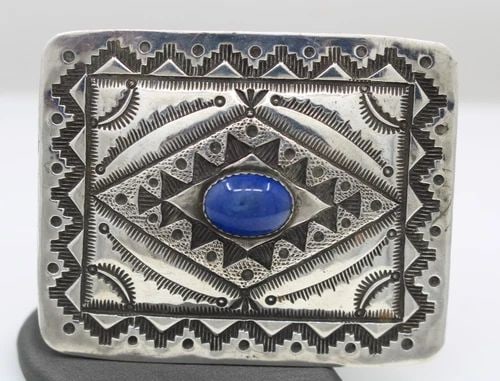 NAVAJO HENRY SAM STERLING SILVER LAPIS BELT BUCKLE 48.6 GRAMS: NAVAJO HENRY SAM STERLING SILVER LAPIS BELT BUCKLE 48.6 GRAMS Description Navajo Henry Sam Sterling Silver Lapis Belt Buckle Belt Buckle is in good condition. May show signs of wear and/or tear. Appro