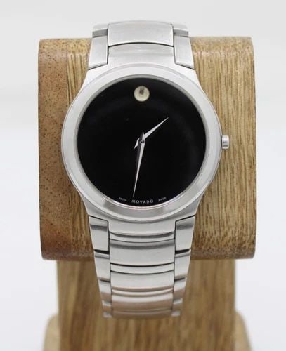 MOVADO KARDELO STAINLESS 36MM BLACK DIAL WATCH 84 G2 1851 W/ BOX & PAPERS: MOVADO KARDELO STAINLESS 36MM BLACK DIAL WATCH 84 G2 1851 W/ BOX & PAPERS Description Movado Kardelo Stainless 36mm Black Dial Watch 84 G2 1851 W/ Box & Papers The watch has been used previously. The 