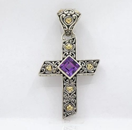 SAMUEL BENHAM STERLING SILVER & 18K YELLOW GOLD AMETHYST CROSS PENDANT: SAMUEL BENHAM STERLING SILVER & 18K YELLOW GOLD AMETHYST CROSS PENDANT Description Samuel Benham Sterling Silver & 18k Yellow Gold Amethyst Cross Pendant Pendant is in good condition. May show signs o