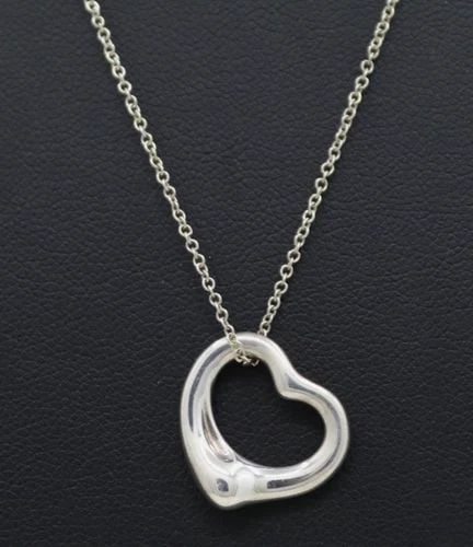 TIFFANY & CO. ELSA PERETTI STERLING SILVER 16MM OPEN HEART PENDANT 18" NECKLACE: TIFFANY & CO. ELSA PERETTI STERLING SILVER 16MM OPEN HEART PENDANT 18" NECKLACE Description Tiffany & Co. Elsa Peretti Sterling Silver 16mm Open Heart Pendant Necklace Necklace/pendant is in good cond