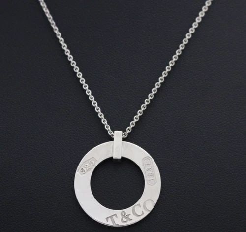TIFFANY & CO. STERLING SILVER 1837 ROUND CIRCLE PENDANT W/ 16" NECKLACE: TIFFANY & CO. STERLING SILVER 1837 ROUND CIRCLE PENDANT W/ 16" NECKLACE Description Tiffany & Co. Sterling Silver 1837 Round Circle Pendant w/ 16" Necklace Necklace/pendant is in good condition. May s
