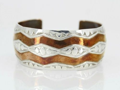 DOUGLAS ETSITTY NAVAJO NATIVE AMERICAN COPPER & STERLING CUFF BRACELET: DOUGLAS ETSITTY NAVAJO NATIVE AMERICAN COPPER & STERLING CUFF BRACELET Description Douglas Etsitty Navajo Native American Copper & Sterling Silver Cuff Bracelet Item is in great condition. May show si