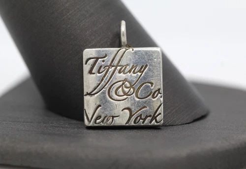 TIFFANY & CO. STERLING SILVER NOTES SQUARE CHARM PENDANT: TIFFANY & CO. STERLING SILVER NOTES SQUARE CHARM PENDANT TIFFANY & CO. STERLING SILVER NOTES SQUARE CHARM PENDANT