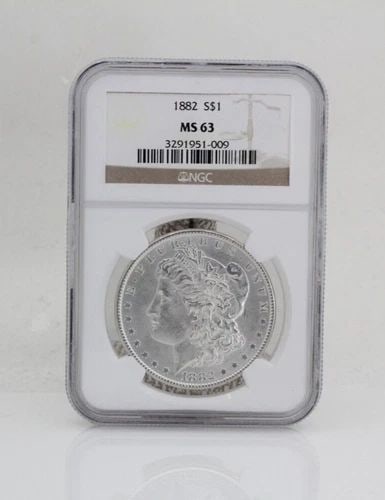 1882 $1 MORGAN SILVER DOLLAR NGC MS 63: 1882 $1 MORGAN SILVER DOLLAR NGC MS 63 1882 $1 MORGAN SILVER DOLLAR NGC MS 63 Description 1882 $1 Morgan Silver Dollar NGC MS 63 Coin is in great condition. Plastic case may show signs of wear and/or 