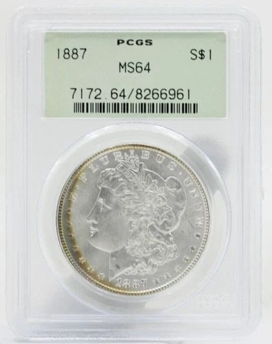 1887 MORGAN SILVER DOLLAR $1 PCGS MS64 OLD GREEN HOLDER: 1887 MORGAN SILVER DOLLAR $1 PCGS MS64 OLD GREEN HOLDER Description 1887 Morgan Silver Dollar $1 PCGS MS64 Old Green Holder Coins has been graded as a MS-64 by NGC. The protective plastic holder may s