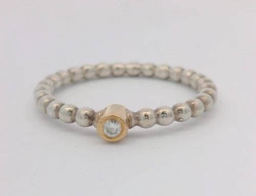 PANDORA STERLING SILVER & 14K YELLOW GOLD DIAMOND EVENING STAR RING 190214D: PANDORA STERLING SILVER & 14K YELLOW GOLD DIAMOND EVENING STAR RING 190214D Description Pandora Sterling Silver & 14k Yellow Gold Diamond Evening Star Ring 190214D Item is in good condition. May show 